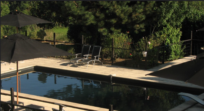Black Swimming Pools with chair asid